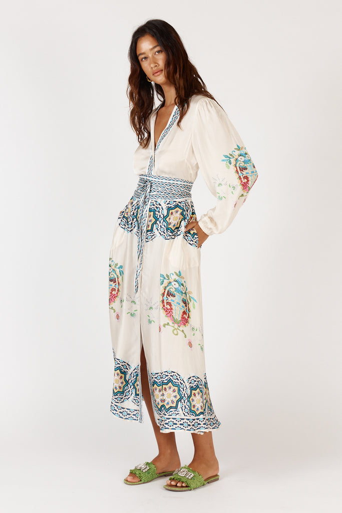 RubyYaya Garcia Maxi Dress side view displaying full-length sleeves and flattering waistline fit.