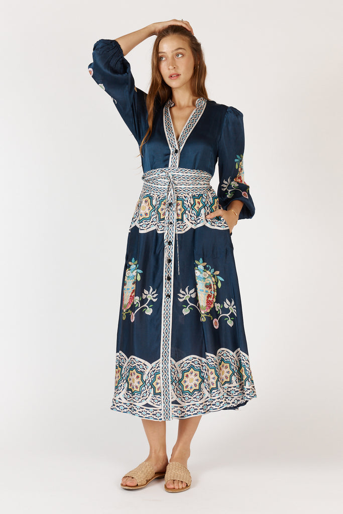 RubyYaya Garcia Maxi Dress Navy front view showing open v-neckline, button-through design, and tie belt.