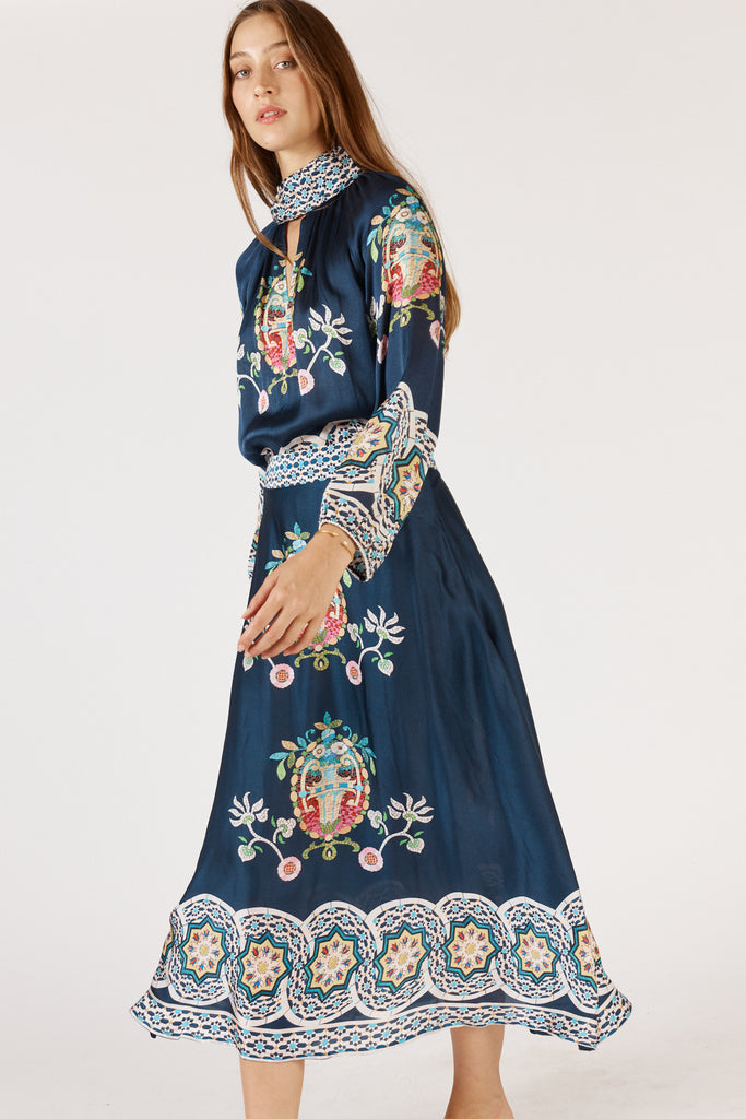 Fashion side-on view of RubyYaya Garcia Shirt Navy styled with relaxed fit and high neck for effortless elegance