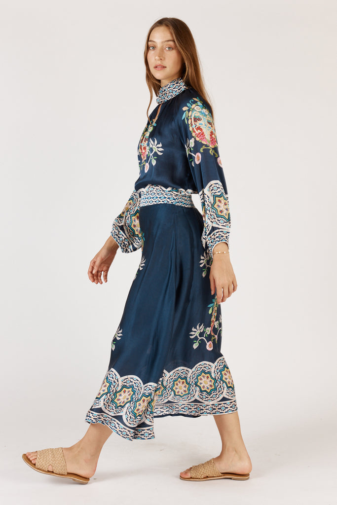 Side view of Rubyyaya Garcia skirt Navy on model showcasing A-line shape and flow