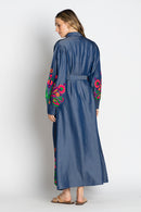 Back view of the Rubyyaya Gokarna Maxi Dress on a model, styled with the separate self-tie belt to define the waist, showcasing the long flowy silhouette and detailed embroidery on breathable cotton fabric.