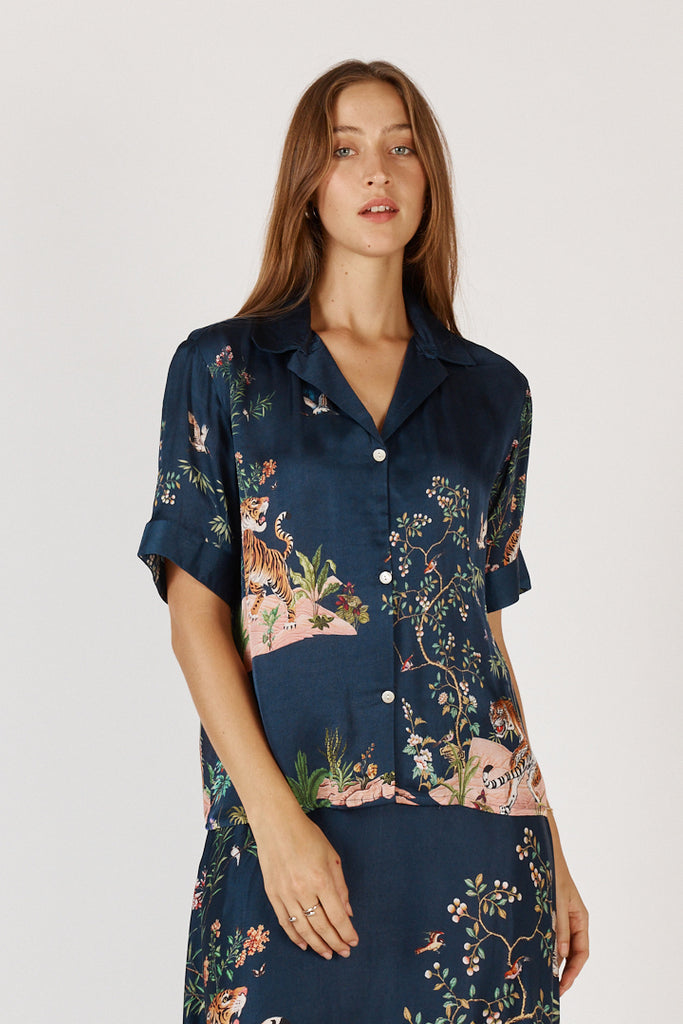 Close-up of RubyYaya Machali Shirt Navy fabric and button detail in exclusive printed viscose satin.