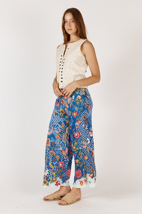 Model wearing Rubyyaya Toscana Pant in viscose satin, styled to show relaxed fit, wide-leg, side pockets, and full-length design